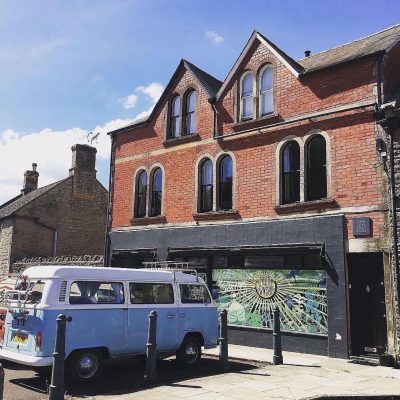 Image of The Old Stores Studio building with VW camper van parked outside